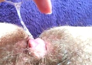 Hairy pussy hoe rubbing her hirsute hole here